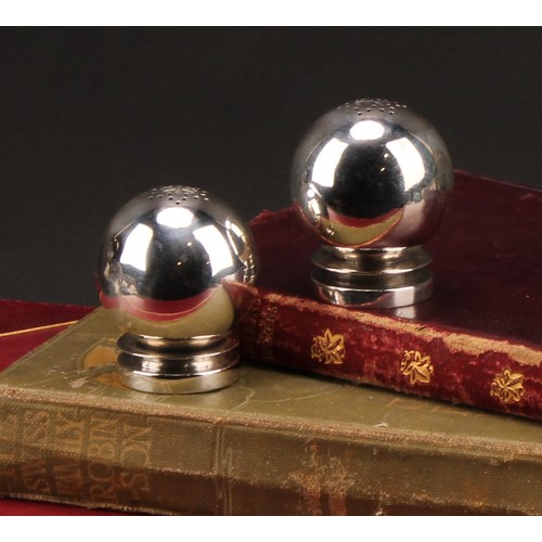 179 - Georg Jensen - a pair of Danish silver globular peppers, design no. 632, 4.5cm high