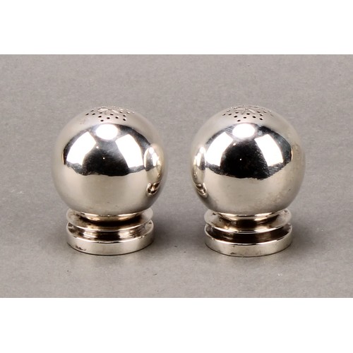 179 - Georg Jensen - a pair of Danish silver globular peppers, design no. 632, 4.5cm high