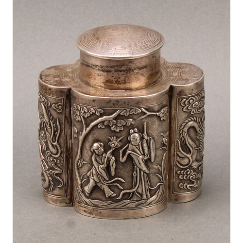 250 - A Chinese silver lobed oval tea caddy, chased in the Cantonese taste with figures and dragons, push-... 