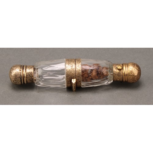 108 - A 19th century gilt silver coloured metal 'binocular' form double-ended scent bottle, hinged to the ... 