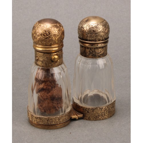 108 - A 19th century gilt silver coloured metal 'binocular' form double-ended scent bottle, hinged to the ... 