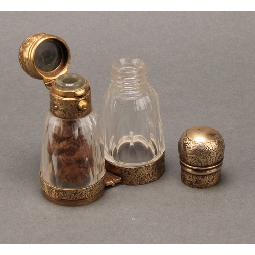 108 - A 19th century gilt silver coloured metal 'binocular' form double-ended scent bottle, hinged to the ... 