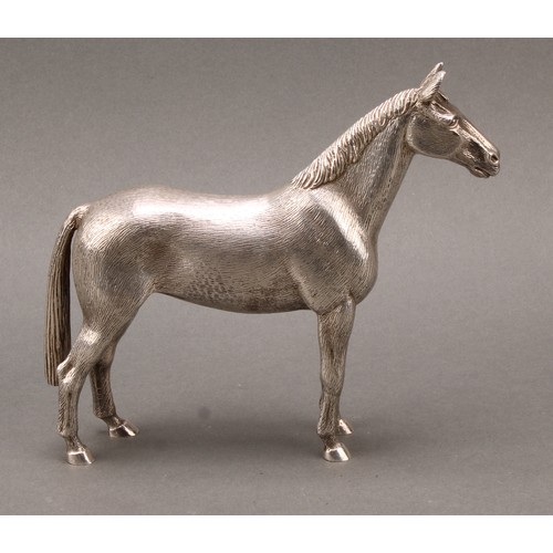 331 - An Elizabeth II cast silver model, of a horse, 16.5cm high, A E Jones, Birmingham 1972, 1048g