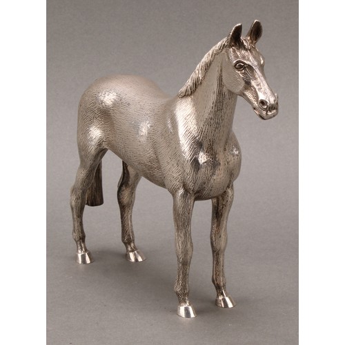 331 - An Elizabeth II cast silver model, of a horse, 16.5cm high, A E Jones, Birmingham 1972, 1048g