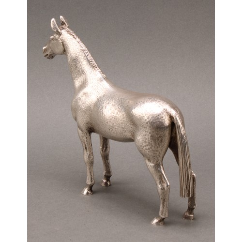 331 - An Elizabeth II cast silver model, of a horse, 16.5cm high, A E Jones, Birmingham 1972, 1048g