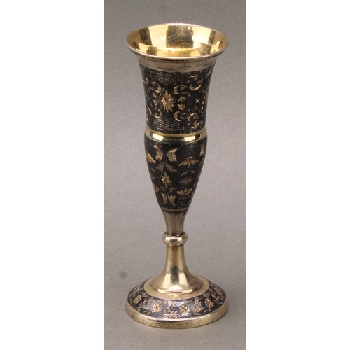 203 - A Russian silver-gilt and niello pedestal vase, bright-cut engraved with strapwork and scrolling lea... 