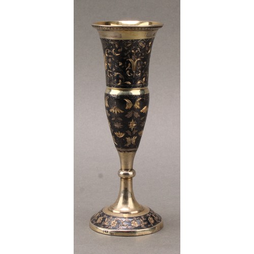 203 - A Russian silver-gilt and niello pedestal vase, bright-cut engraved with strapwork and scrolling lea... 