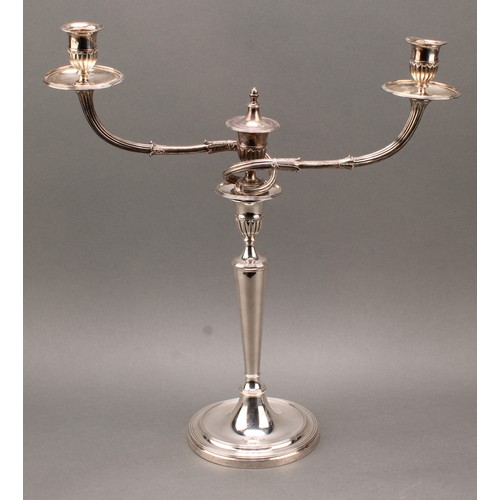 383 - A pair of George III cast silver two-light table candelabra, batwing-fluted campana sconces, acanthu... 