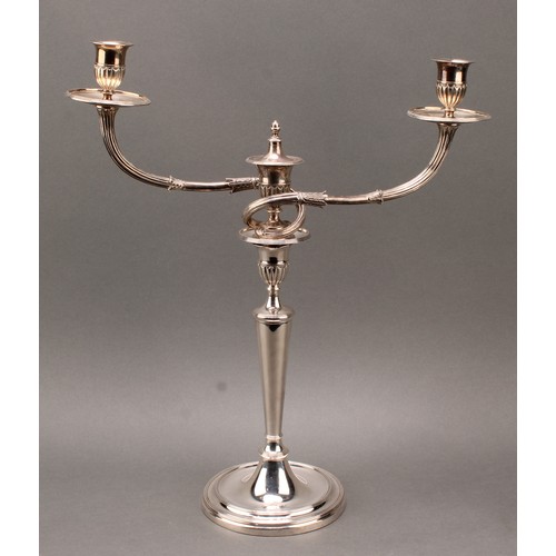 383 - A pair of George III cast silver two-light table candelabra, batwing-fluted campana sconces, acanthu... 