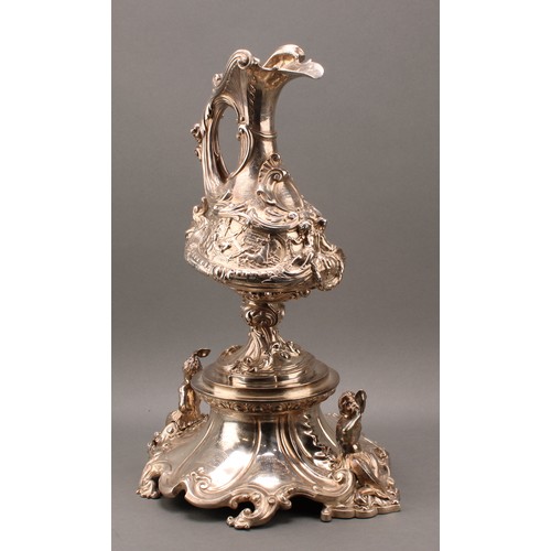 428 - A substantial and sculptural Victorian silver presentation ewer and stand, boldly cast in the Baroqu... 