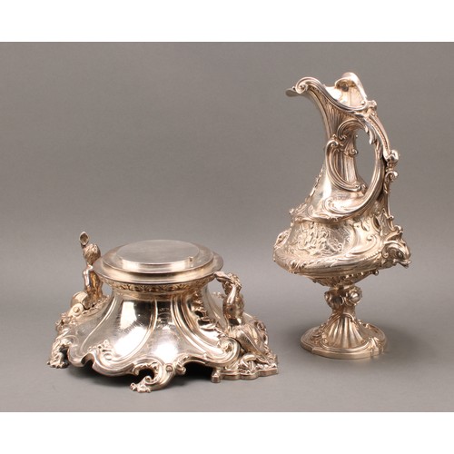 428 - A substantial and sculptural Victorian silver presentation ewer and stand, boldly cast in the Baroqu... 