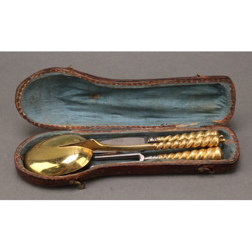 14 - A 17th century German silver-gilt travelling knife, fork and spoon, wrythen handles, the spoon 16.5c... 