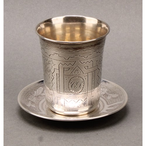 166 - A Russian silver beaker and stand, bright-cut engraved with strapwork and wrigglework, gilt interior... 