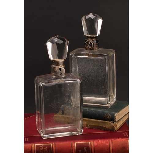 389 - A pair of George V silver mounted rectangular glass lockable decanters, 26cm high, Hukin & Heath, Bi... 