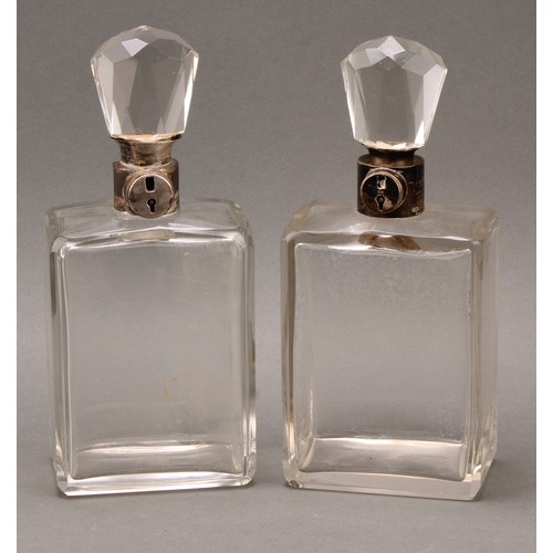 389 - A pair of George V silver mounted rectangular glass lockable decanters, 26cm high, Hukin & Heath, Bi... 