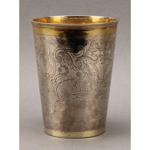 97 - A large 18th century Russian parcel-gilt silver tapered cylindrical beaker, engraved throughout with... 