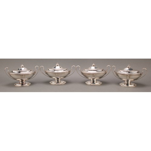 395 - A set of four George III Neo-Classical silver oval pedestal sauce tureens and covers, applied with s... 