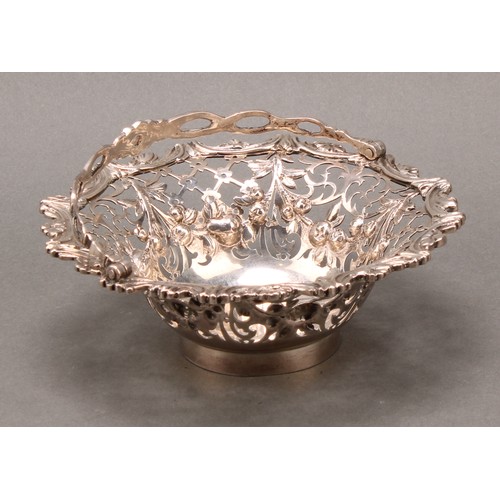 343 - A George III silver swing-handled sweetmeat basket, pierced and cast with flowering swags, trellis a... 