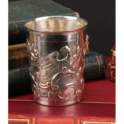 446 - An 18th century Russian silver tapered cylindrical beaker, chased with eagles, Classical pedestals, ... 