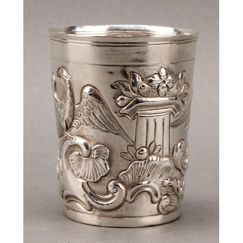 446 - An 18th century Russian silver tapered cylindrical beaker, chased with eagles, Classical pedestals, ... 