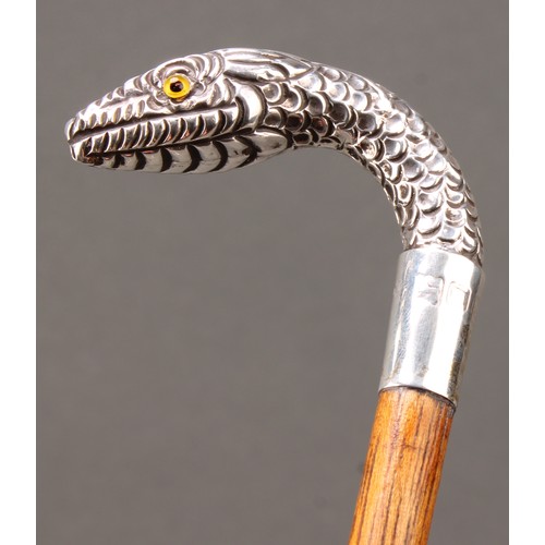 1764 - An Edwardian silver mounted walking stick, the handle as a snake's head, palmwood cane, glass eyes, ... 