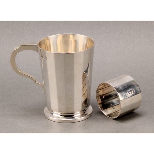 233 - Tiffany & Co - a George V silver christening mug and napkin ring, of substantial gauge, the mug 9.5c... 