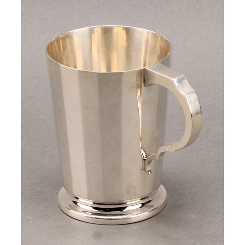 233 - Tiffany & Co - a George V silver christening mug and napkin ring, of substantial gauge, the mug 9.5c... 