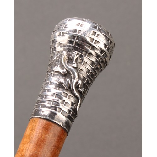 1747 - A 19th/20th century walking stick or cane, the silver metal pommel cast with a salamander, indistinc... 