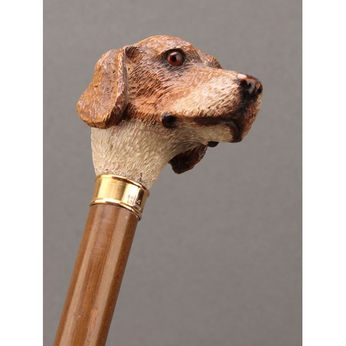 1761 - An early 20th century walking stick or cane, by Brigg, the handle carved as the head of a hound dog,... 