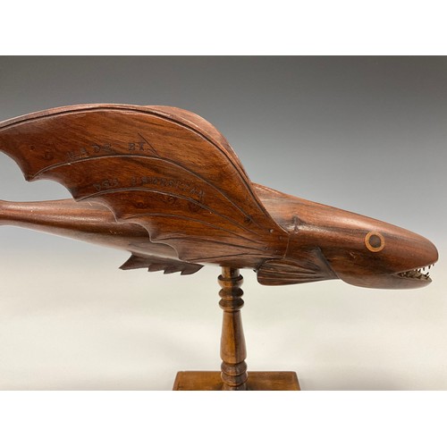 1859 - A Pitcairn Island carved flying fish, with the inscription ‘made by Des Christian’ to one wing, and ... 