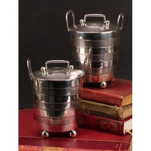 373 - A pair of early 19th century Indian Colonial silver faux-coopered butter coolers and covers, ball fe... 