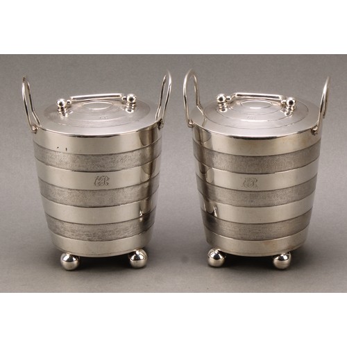 373 - A pair of early 19th century Indian Colonial silver faux-coopered butter coolers and covers, ball fe... 