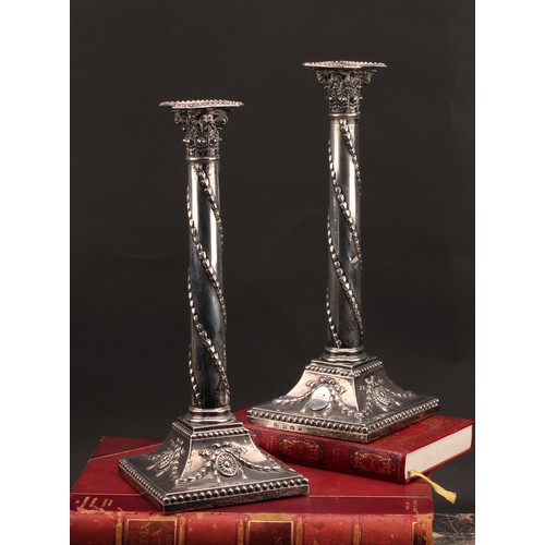 385 - A pair of George III silver Corinthian column candlesticks, chased in the Neo-Classical taste with r... 