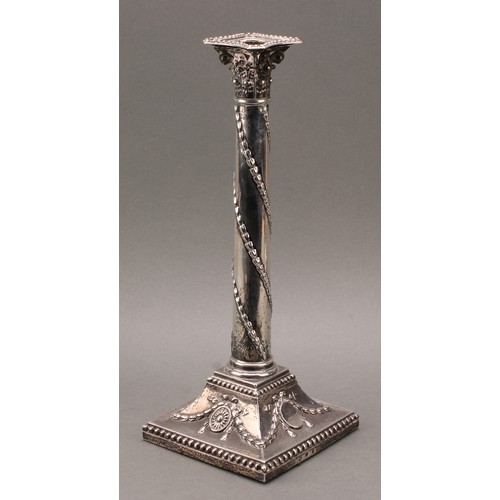 385 - A pair of George III silver Corinthian column candlesticks, chased in the Neo-Classical taste with r... 