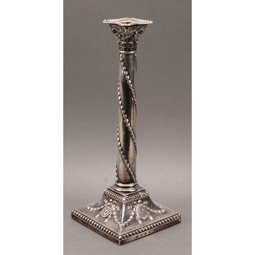 385 - A pair of George III silver Corinthian column candlesticks, chased in the Neo-Classical taste with r... 