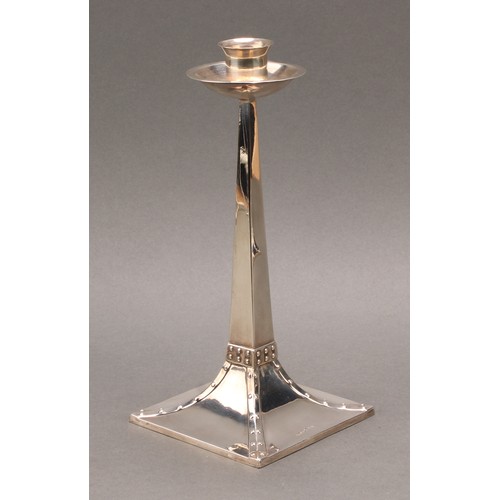 151 - A pair of Arts and Crafts silver candlesticks, the design attributed to Jan Eisenloeffel (1876-1957)... 