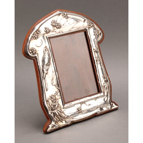 147 - A pair of Art Nouveau period silver easel photograph frames, embossed in the Aesthetic Movement tast... 