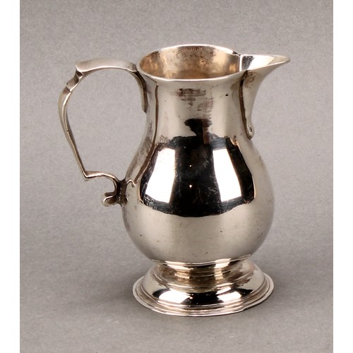 263 - A George II silver baluster sparrow beak cream jug, scroll-capped handle, domed foot, 8.5cm high, Lo... 