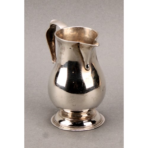 263 - A George II silver baluster sparrow beak cream jug, scroll-capped handle, domed foot, 8.5cm high, Lo... 