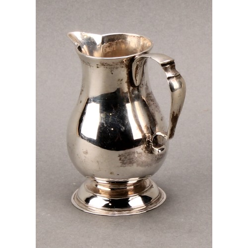 263 - A George II silver baluster sparrow beak cream jug, scroll-capped handle, domed foot, 8.5cm high, Lo... 