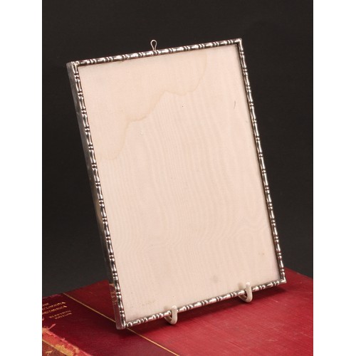 478 - An Elizabeth II silver easel photograph frame, in the Chinese taste, faux bamboo border, 20.5cm high... 