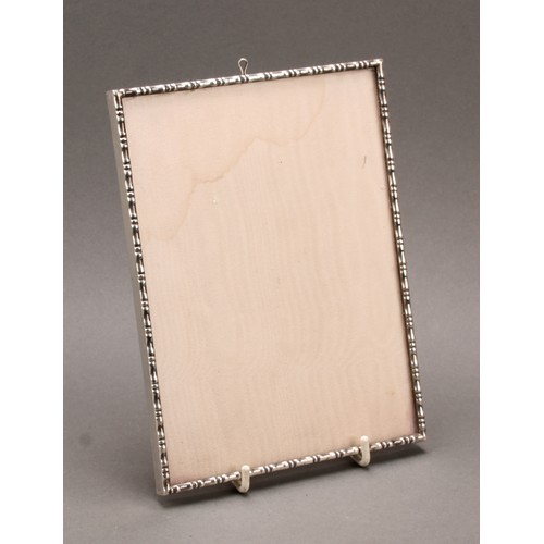 478 - An Elizabeth II silver easel photograph frame, in the Chinese taste, faux bamboo border, 20.5cm high... 