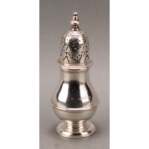 1497 - A pair of unusual George I silver pear shaped casters, knop finials, the bell shaped covers with rar... 