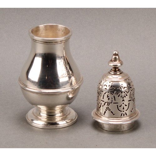 1497 - A pair of unusual George I silver pear shaped casters, knop finials, the bell shaped covers with rar... 