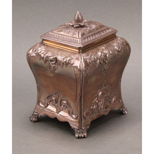 264 - A George II silver bombe shaped tea caddy, chased in the Rococo taste with flowering swags and leafy... 