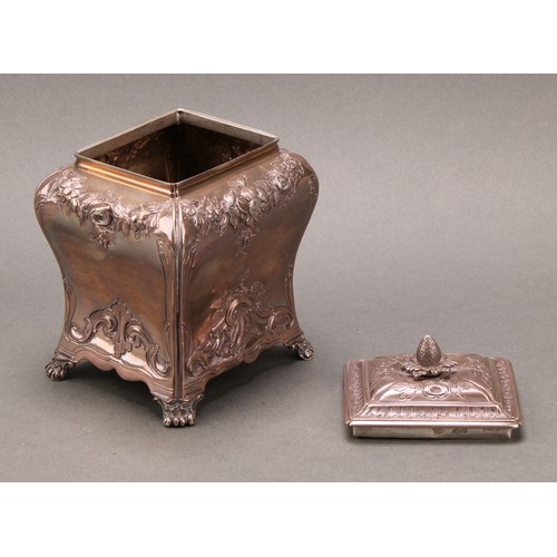 264 - A George II silver bombe shaped tea caddy, chased in the Rococo taste with flowering swags and leafy... 