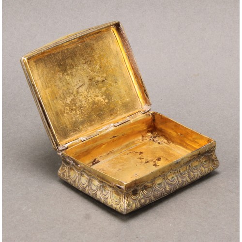 443 - An 18th century Continental silver-gilt waisted rectangular snuff box, chased overall with 'snake sk... 