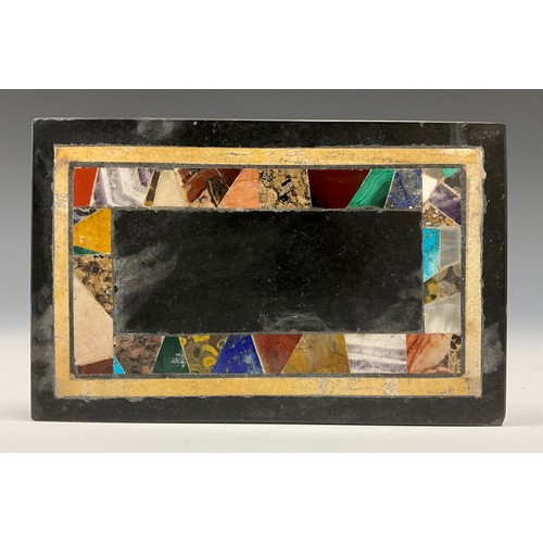 2111 - A granite and pietra dura rectangular desk weight, inlaid with malachite, onyx, lapis lazuli, and ot... 