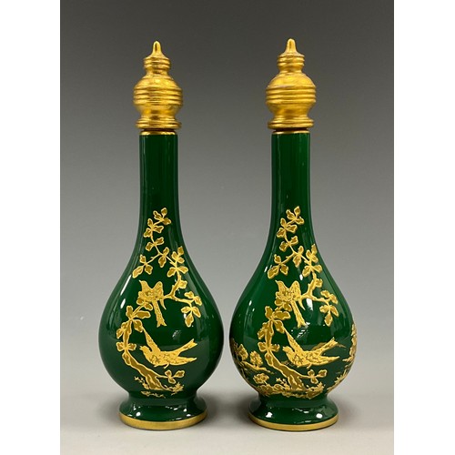 1225 - A pair of Lynton porcelain tear-shaped scent bottles, the green grounds applied with gilt and tooled... 