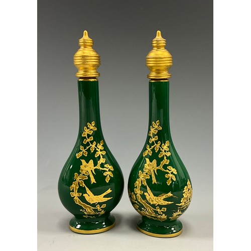 1225 - A pair of Lynton porcelain tear-shaped scent bottles, the green grounds applied with gilt and tooled... 